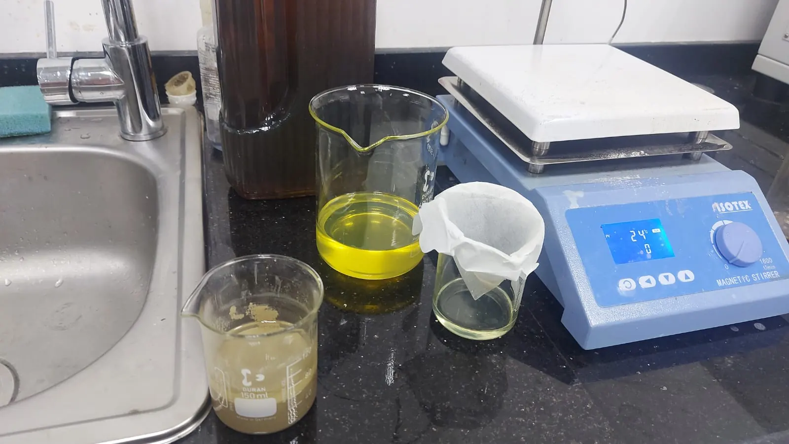 The bench: beakers of untreated and treated samples beside the magnetic stirrer